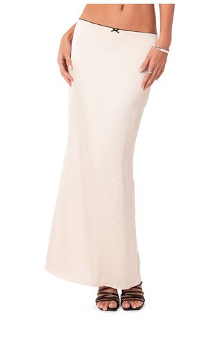 a model wears a white Low Rise Satin Maxi Skirt