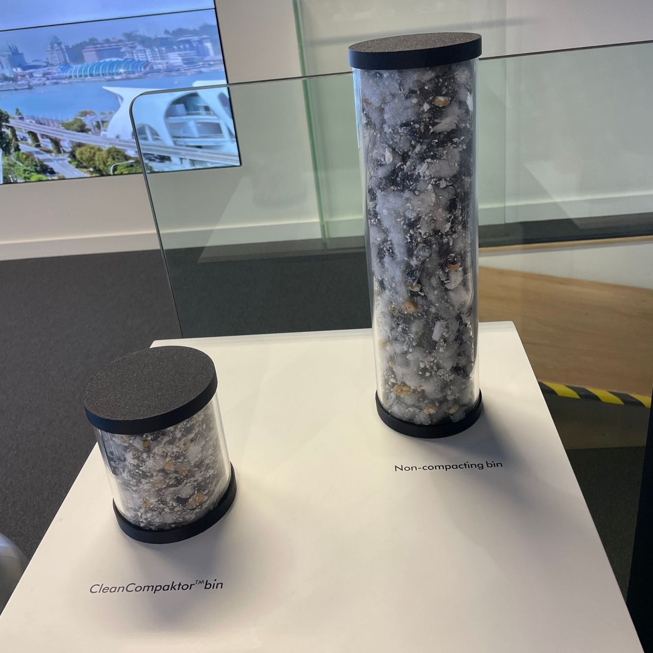 Two tubes of debris, one smaller than the other on a white table
