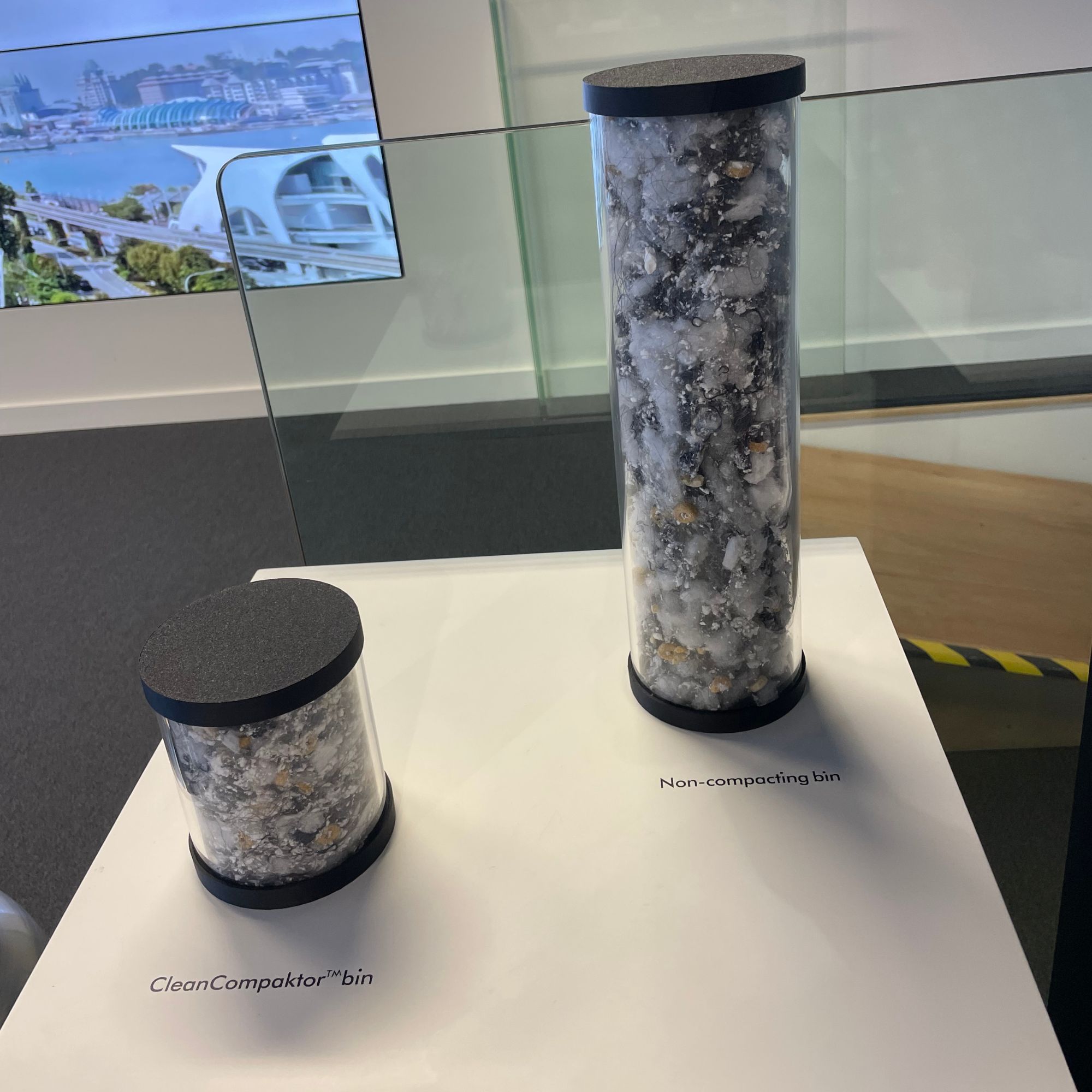 Two tubes of debris, one smaller than the other on a white table