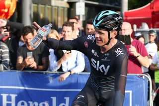 Chris Froome waves to the crowd