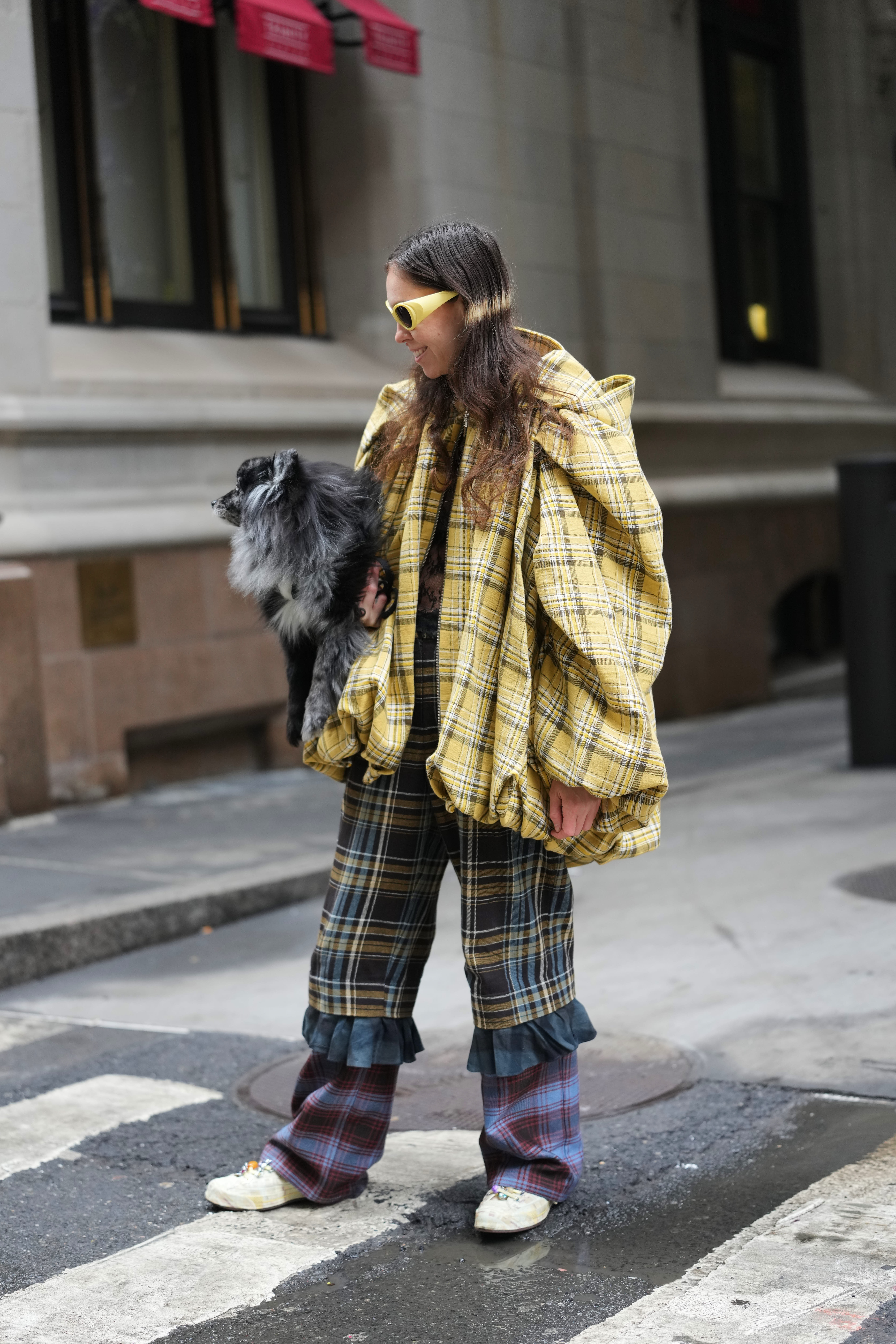 Woman wearing Collina Strada patterned pants.