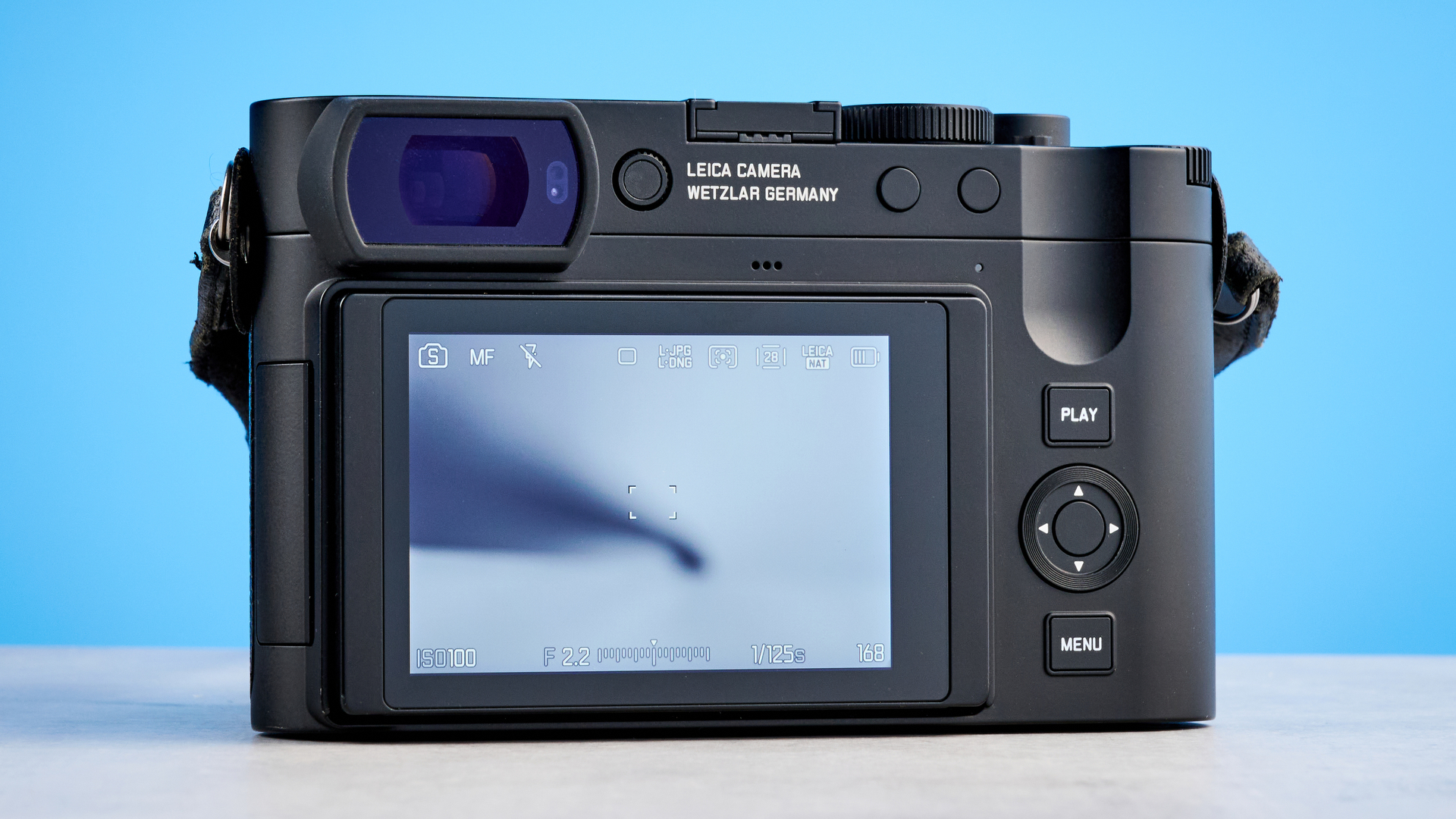 A black Leica Q3 Monochrom black-and-white mirrorless camera