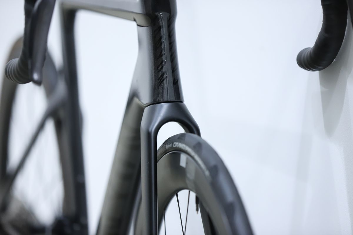 A Black Canyon Aeroad CFR stands against a white wall