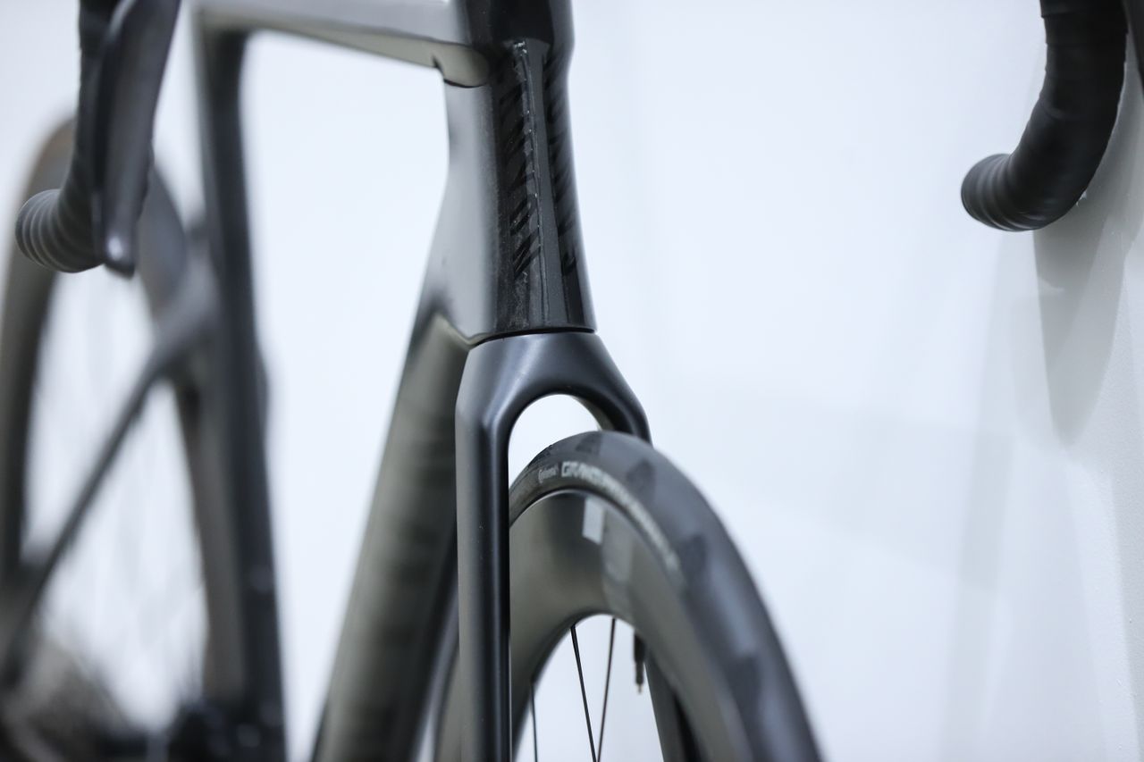 A Black Canyon Aeroad CFR stands against a white wall