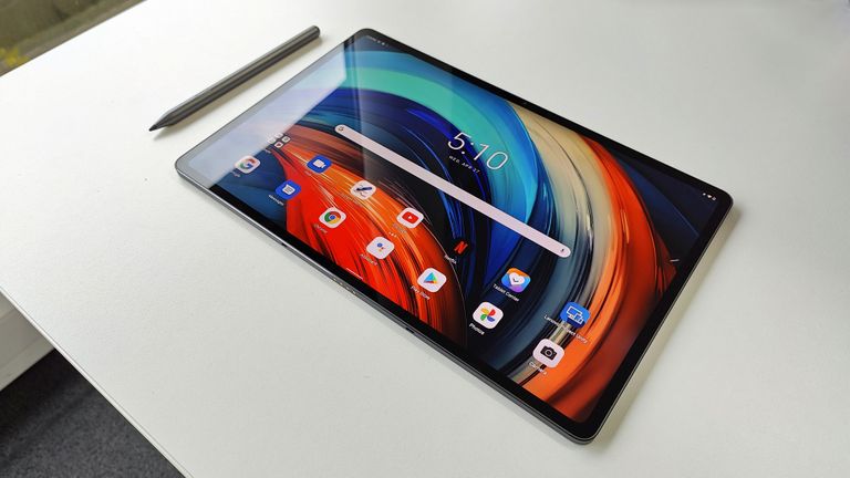 Lenovo Tab P12 Pro review: woman using a tablet as second screen for work