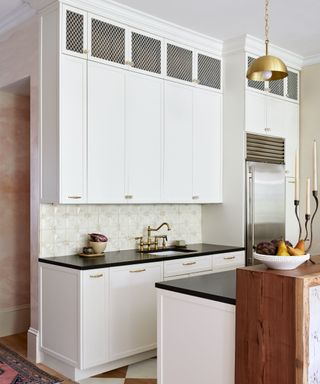 A white kitchen with textural details