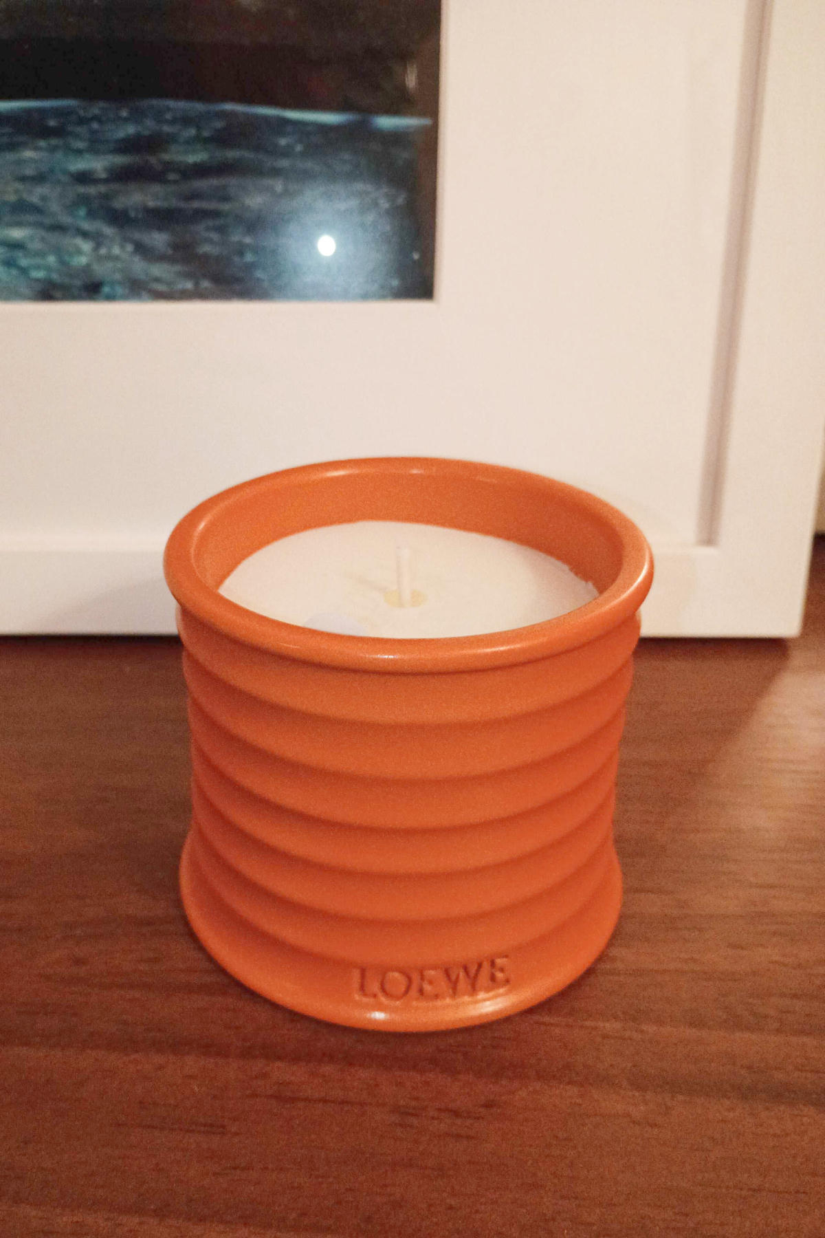 loewe orange blossom candle ona wooden base