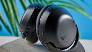 the JBL Tour One M2 headphones with black cups and a black exterior with bluetooth and 2.5mm jack connections