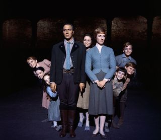 Julie Andrews and Christopher Plummer are flanked on all sides by their children, all members of the singing Von Trapp family, in this publicity handout from the 1965 adaption of the Rogers and Hammerstein musical, The Sound of Music