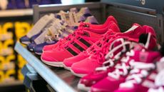 Women’s running shoes on display in an Adidas store