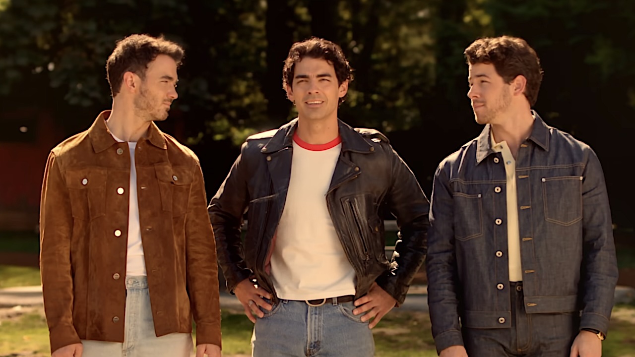 The Jonas Brothers staring out at the lake in the Camp Rock 3 teaser trailer