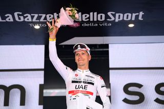 COGNE ITALY MAY 22 Joo Almeida of Portugal and UAE Team Emirates White Best Young Rider Jersey celebrates at podium during the 105th Giro dItalia 2022 Stage 15 a 177km stage from Rivarolo Canavese to Cogne 1622m Giro WorldTour on May 22 2022 in Cogne Italy Photo by Tim de WaeleGetty Images