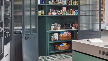 a teal pantry in a modern kitchen