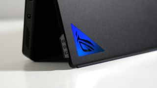 Asus ROG Flow Z13 (2025) with its kickstand slightly ajar, highlighting the ROG logo and attachment that helps lift it.