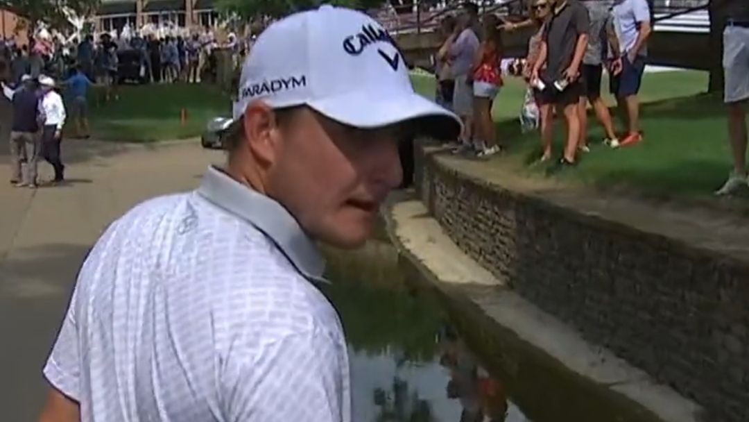 Emiliano Grillo watches his ball roll in an aqueduct at the 2023 Charles Schwab Challenge