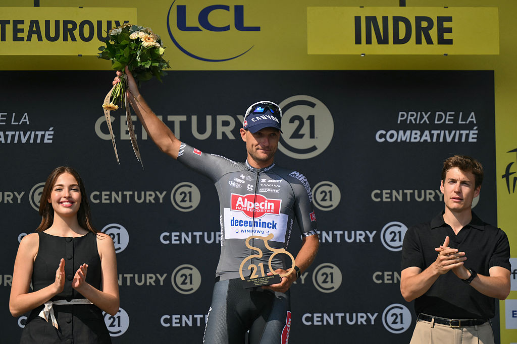 Alpecin - Deceuninck team's Belgian rider Jonas Rickaert celebrates on the podium with the most combative rider's award after the 9th stage of the 112th edition of the Tour de France cycling race, 174.1 km between Chinon and Chateauroux, central France, on July 13, 2025. (Photo by Marco BERTORELLO / AFP) (Photo by MARCO BERTORELLO/AFP via Getty Images)