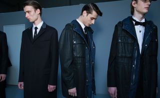 Males modelling long dark coats