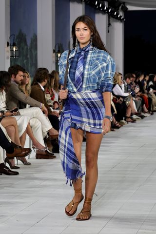 Grace Burns walks the runway at Ralph Lauren's spring/summer 2025 runway show at new york fashion week wearing a plaid outfit