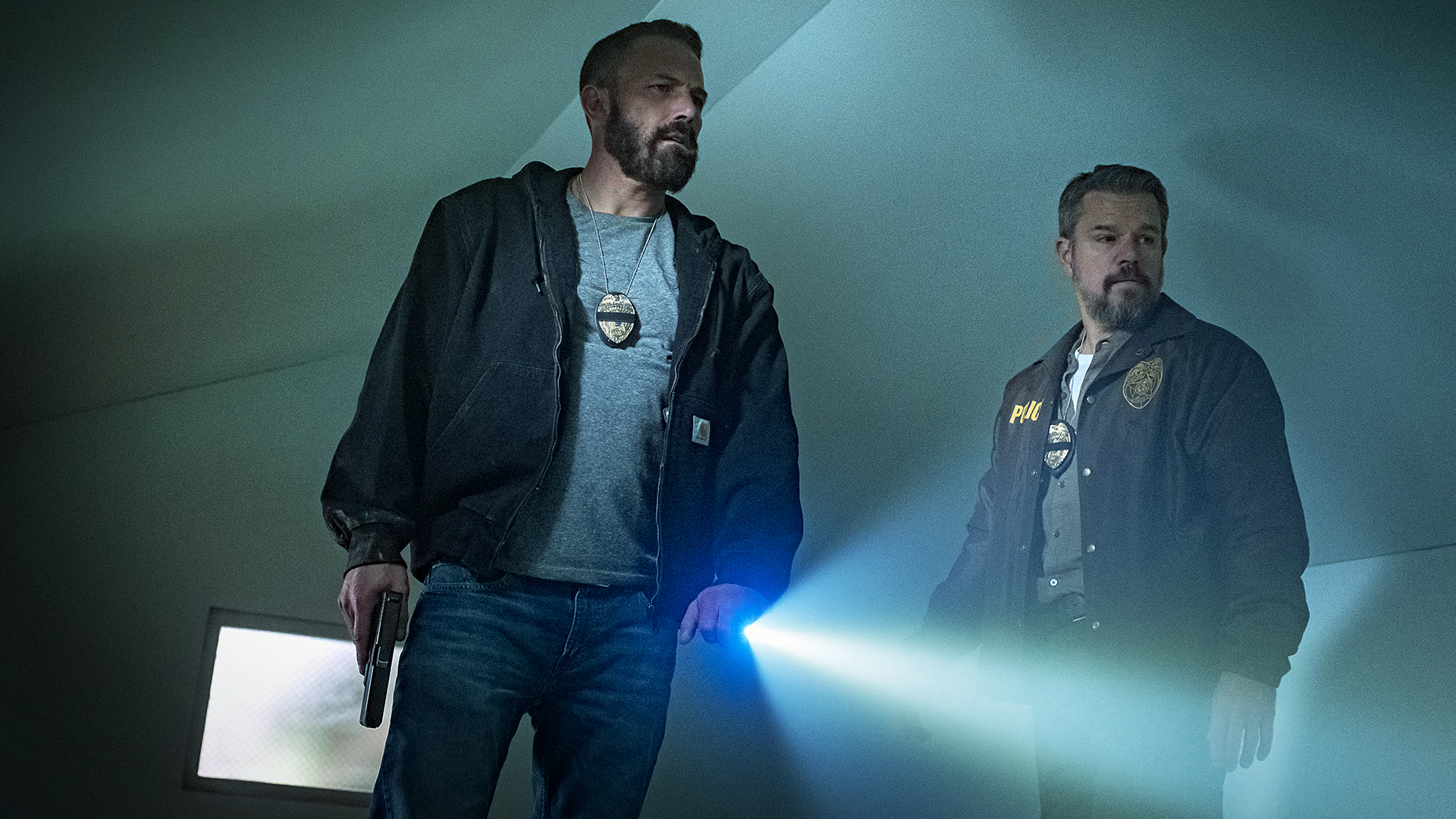 Ben Affleck and Matt Damon's cops standing in a dimly lit room in Netflix's The RIP movie