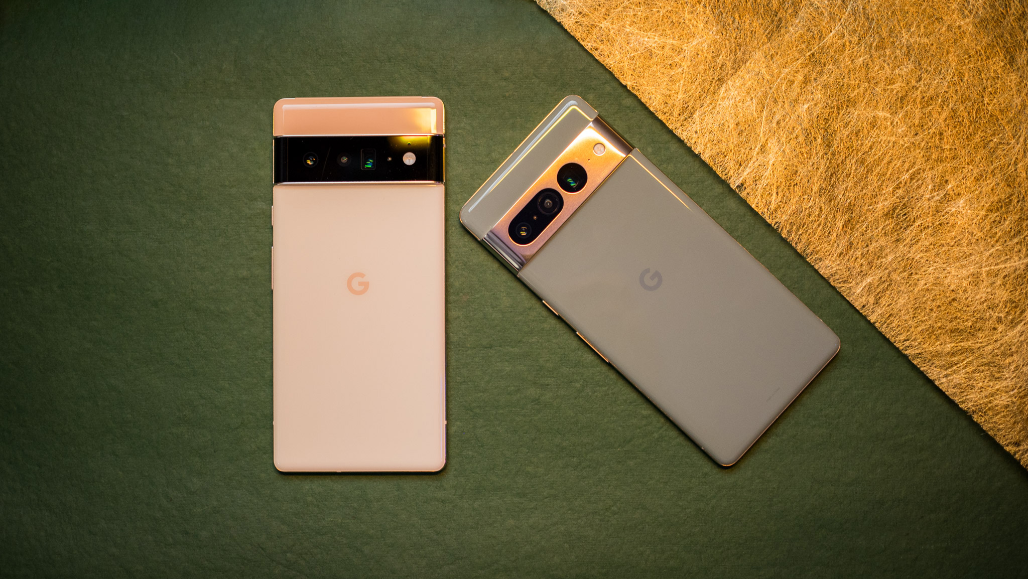 Google Pixel 7 Pro and Pixel 6 Pro on green and gold background