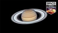 photo of saturn and its rings against the blackness of space