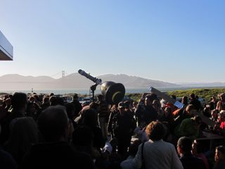 A "sun gun" shows an image of the partial solar eclipse of May 20, 2012 in San Francisco as the Golden Gate Bridge looms in the background.