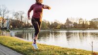 woman running with sports watch