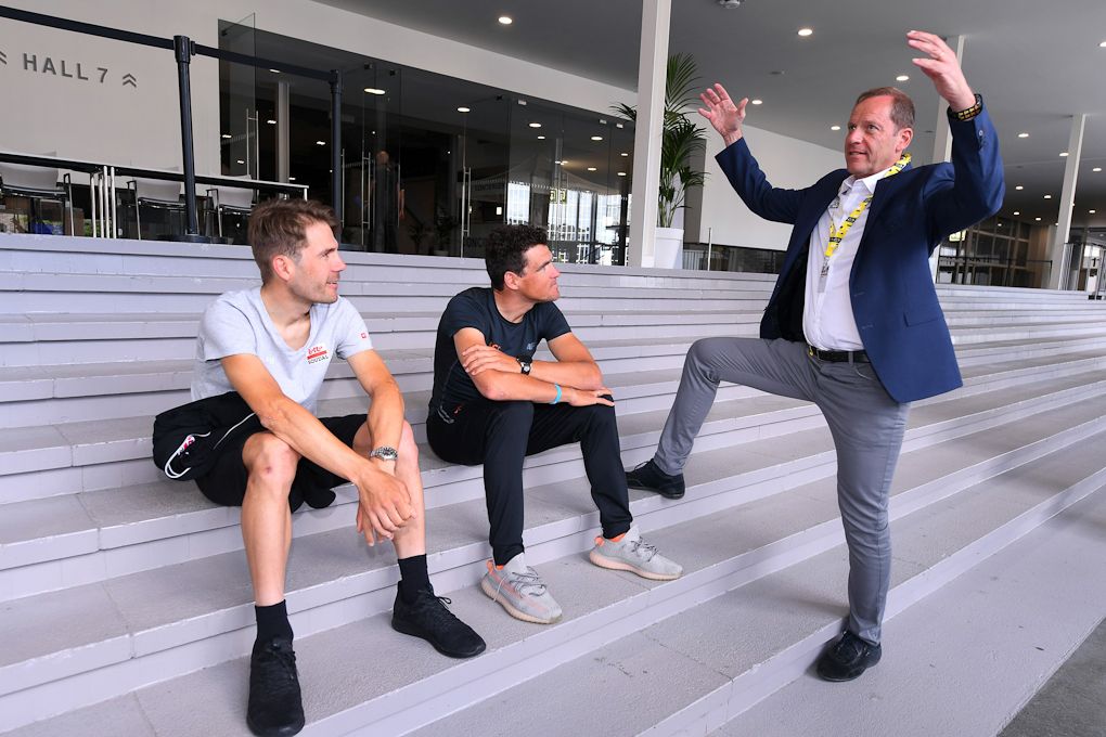 Remco Evenepoel, Greg Van Avermaet and Maxime Monfort with Tour de France director Christian Prudhomme