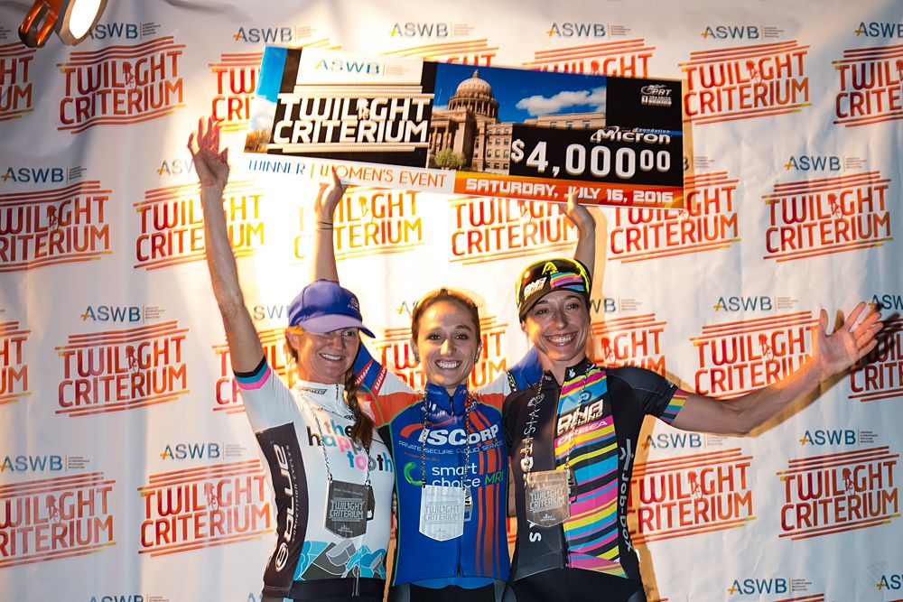 Christina Gokey Smith, Sam Schneider and Mindy McCutcheon on the podium