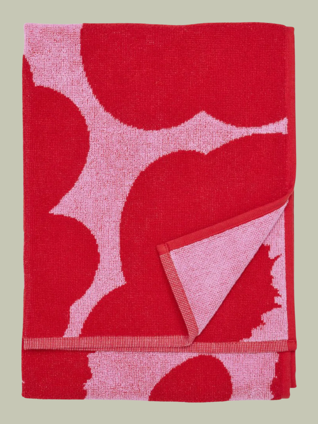 A pink and red reversible towel from Marimekko