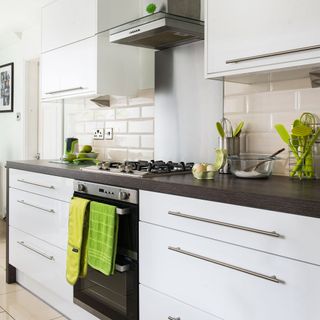 cooking area with white coloured and green napkin