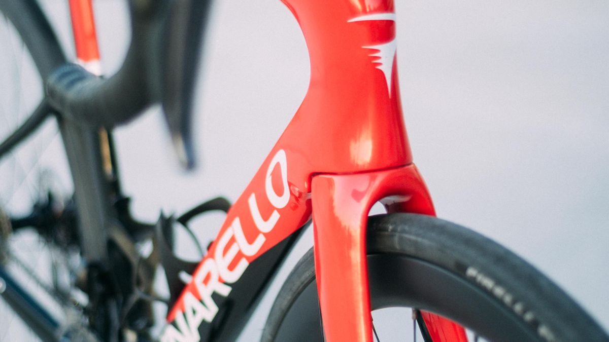 A red and black pinarello F road bike
