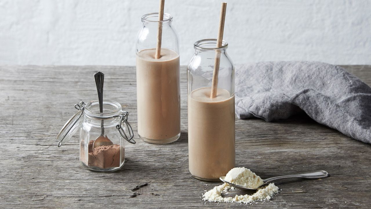 Smoothie on a table surrounded by its ingredients
