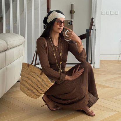 tijan serena poses with a straw basket bag