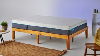 The Simba Hybrid Mattress on a wooden bed frame, photographed in our studio