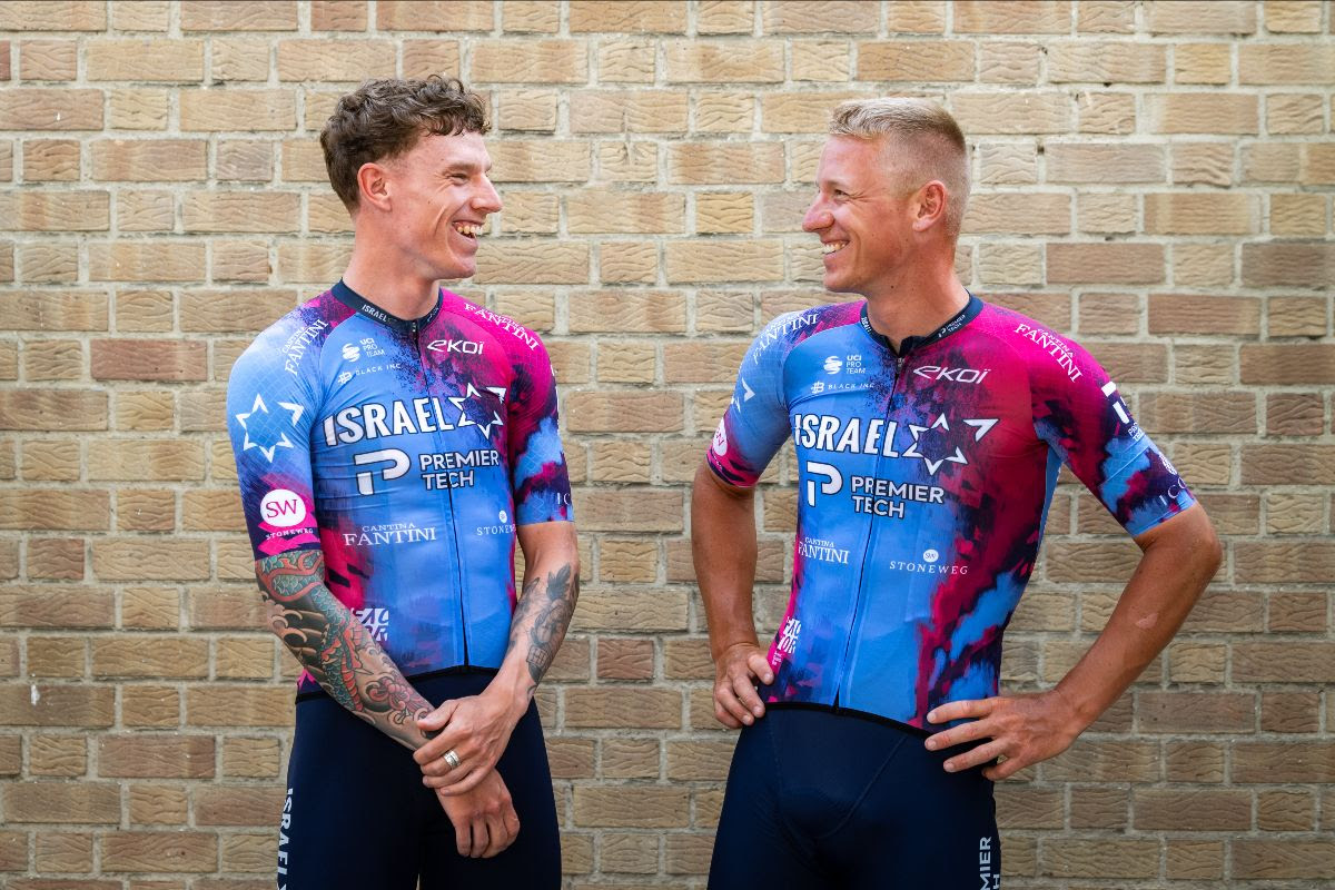 Jake Stewart and Pascal Ackermann in the Tour de France IPT kit, which is light blue and purple