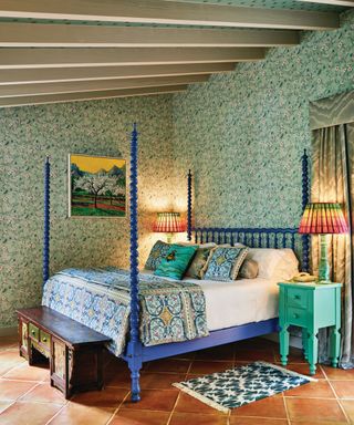 Green bedroom with four poster bed