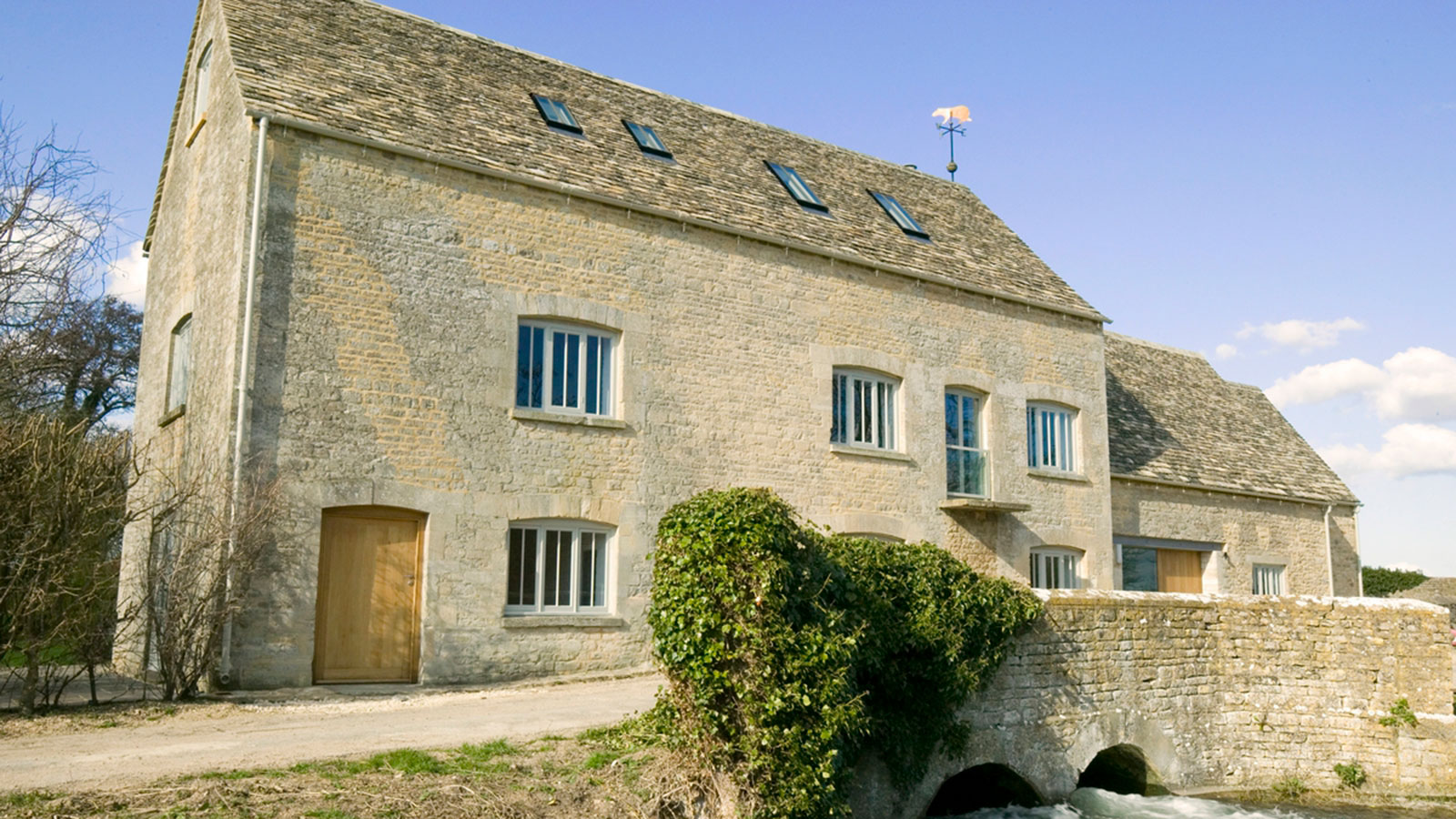 converted traditional stone mill with conservation rooflights in the roof