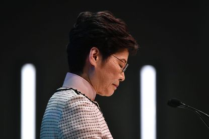 Hong Kong's Chief Executive Carrie Lam speaks at a press conference in Hong Kong on October 16, 2019, after she tried twice to begin her annual policy address inside the city's legislature. -