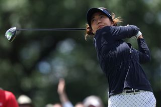 Jenny Shin hits a driver and watches a flight