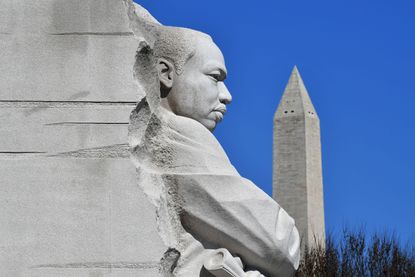 The Washington Monument behind the "Stone of Hope" statue