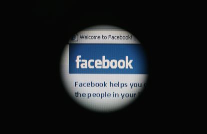 The Facebook site through a laptop screen