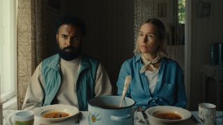 himesh patel and sarah goldberg sit at a dinner table in the movie bubble and squeak