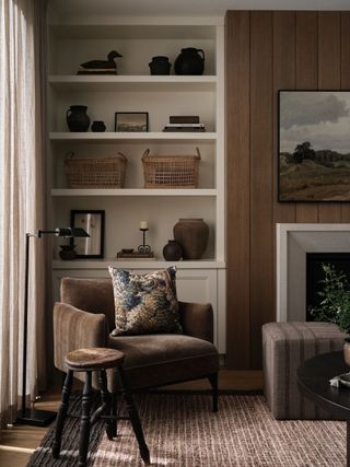 brown rug in neutral living room