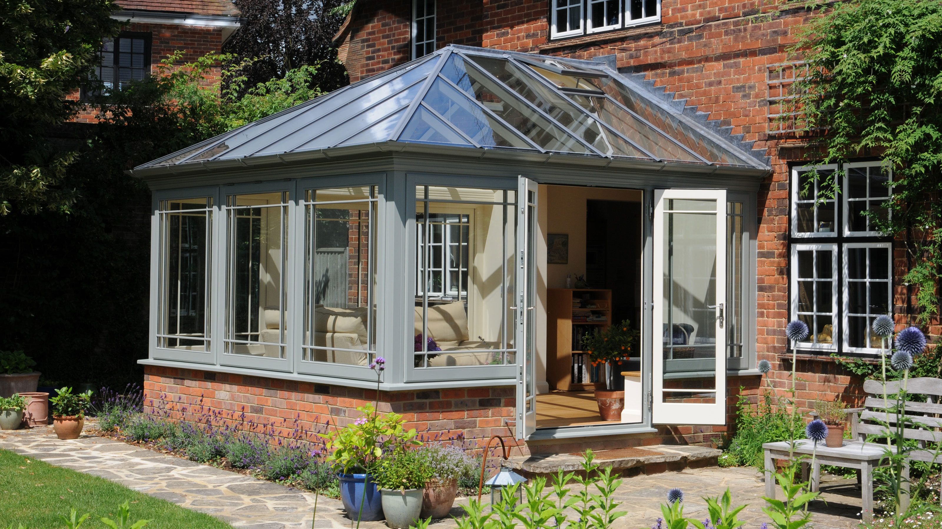 grey conservatory with dwarf brick wall