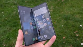 xiaomi mix fold 4 review images showing off the phone from multiple angles