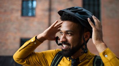 Man with cycling helmet on