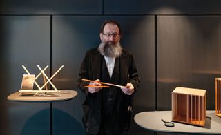 Artistic director Michele De Lucchi with wooden italian artifact