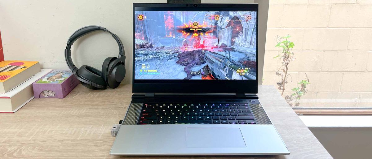 Framework Laptop 16 review unit on table with Doom Eternal playing