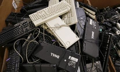 Used personal computer keyboards wait to be recycled